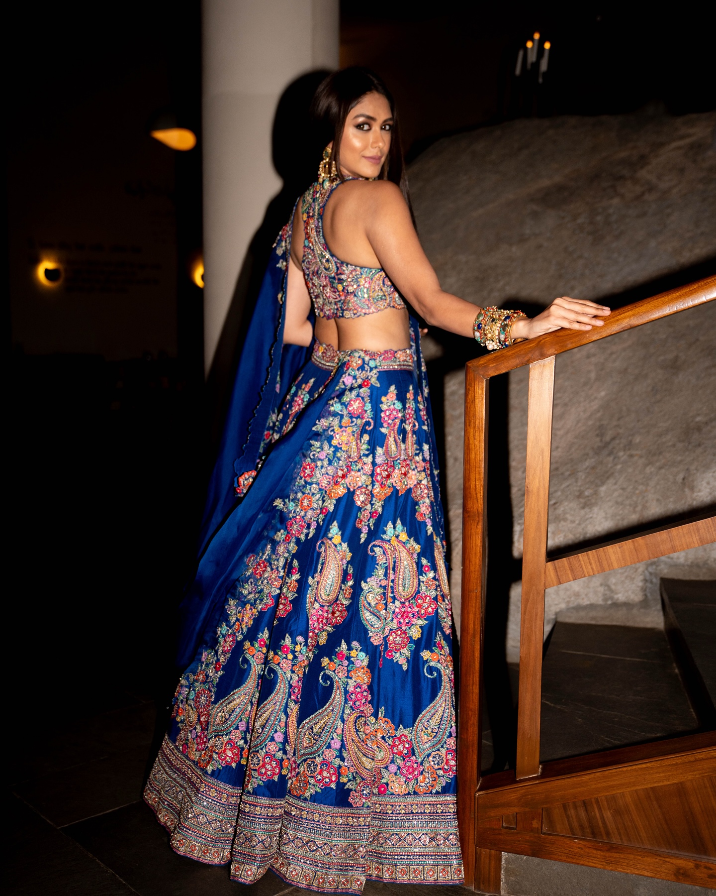 Mrunal Thakur dazzles in a royal blue lehenga adorned with intricate floral and paisley embroidery.