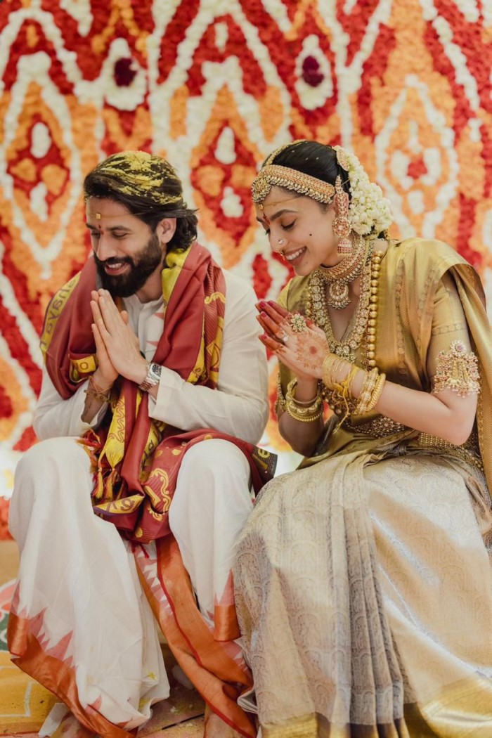Sobhita Dhulipala looked resplendent in a traditional Kanjivaram silk saree with real gold zari, while Naga Chaitanya honored his heritage by wearing a traditional Pancha.
