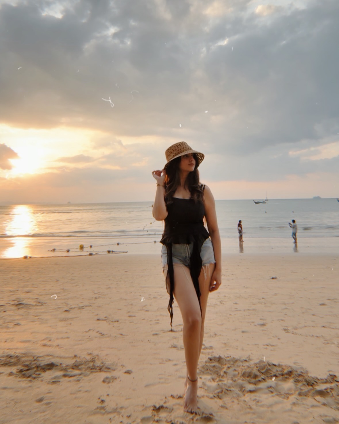 Niveditha Gowda is wearing a stylish black sleeveless top with a minimalistic and elegant design.