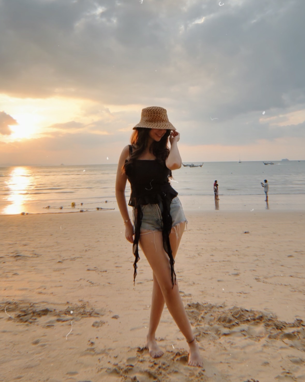 Niveditha Gowda is wearing a stylish black sleeveless top with a minimalistic and elegant design.