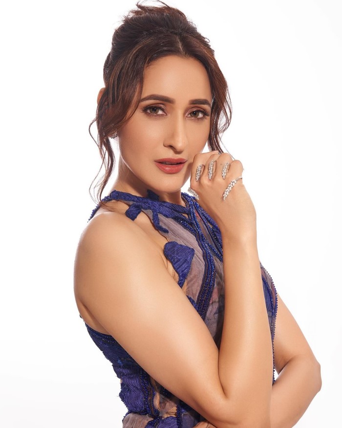 Pragya opts for minimal accessories, allowing her stunning dress and ethereal overlay to take center stage, enhancing her natural beauty and grace.