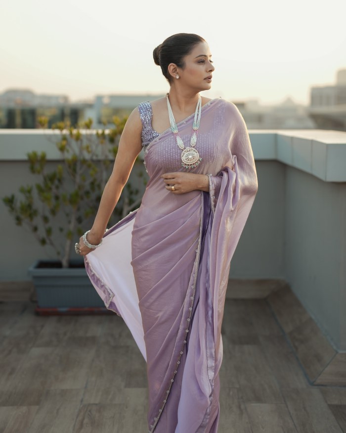 Priyamani's hairstyle perfectly complements her saree look, with soft curls or an elegant updo adding to her overall charm and sophistication.