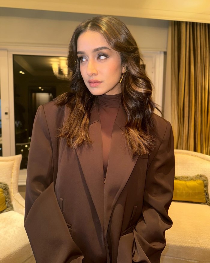 Shraddha Kapoor elevates her look with a well-fitted brown blazer, exuding elegance and confidence.