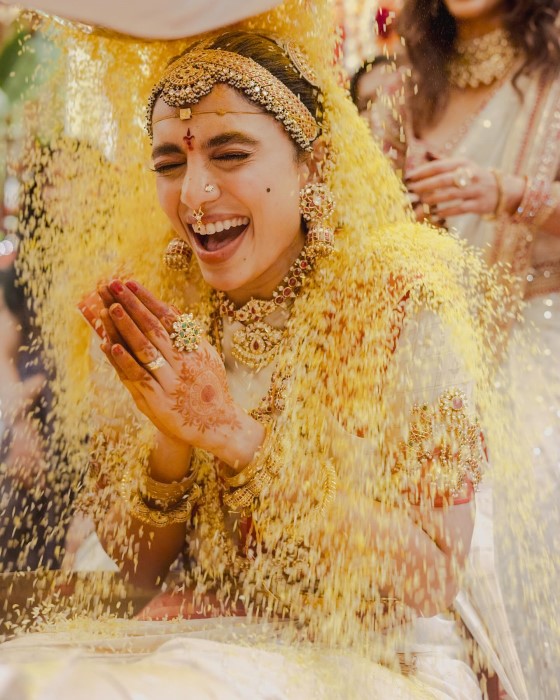 The pictures highlight traditional Telugu wedding rituals, such as the Talambralu ceremony where the couple pours a rice and turmeric mixture over each other’s heads.
