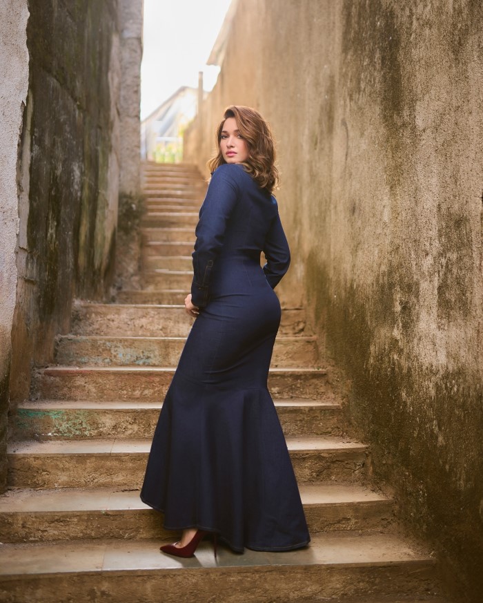 Tamannaah’s fashion choices range from ultra-glamorous red carpet gowns to casual yet chic denim looks, as seen in the image