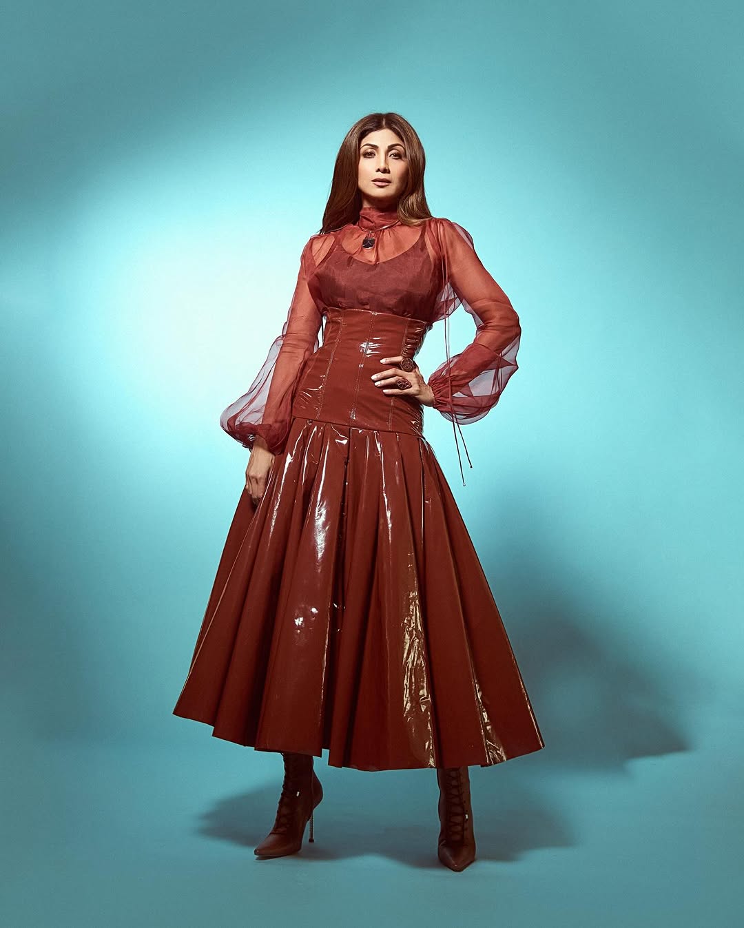 Shilpa dons a brown leather corset-inspired outfit, paired with a soft glam look.