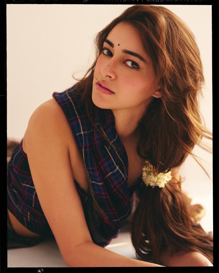 Ananya's poised and relaxed posture exudes elegance and sophistication, capturing the viewer's attention.