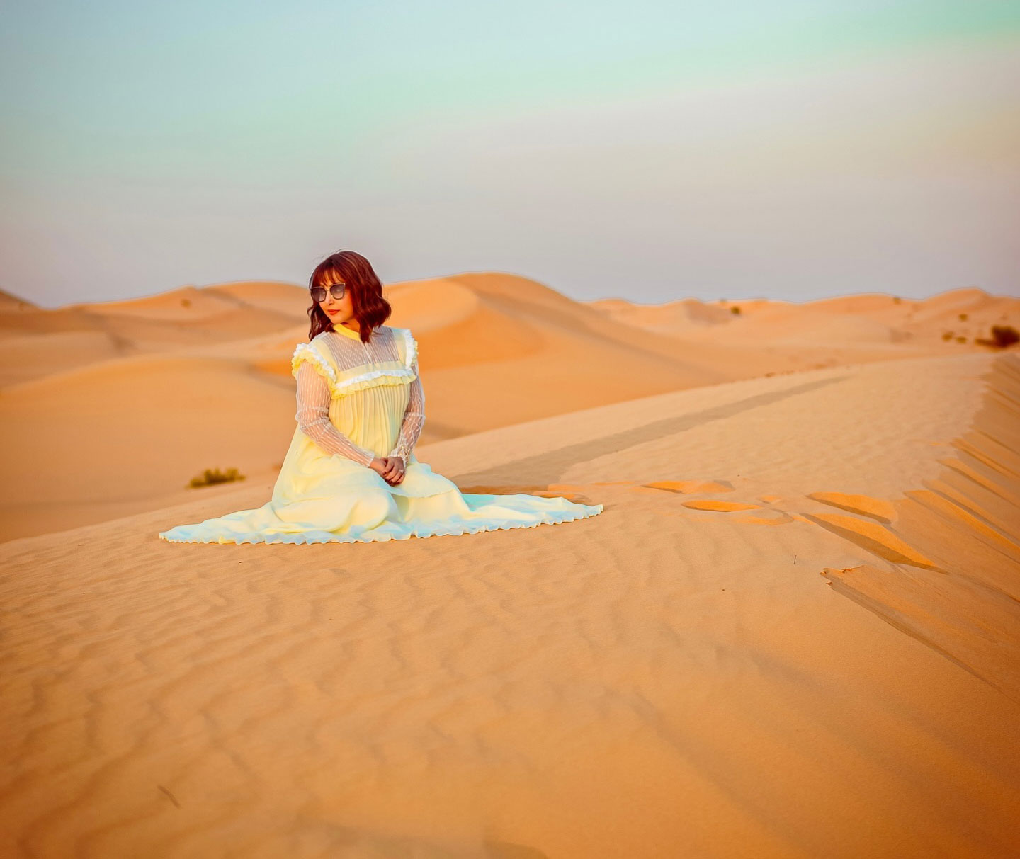 Hina Khan dazzles in an off-white gown that harmonizes with the desert backdrop
