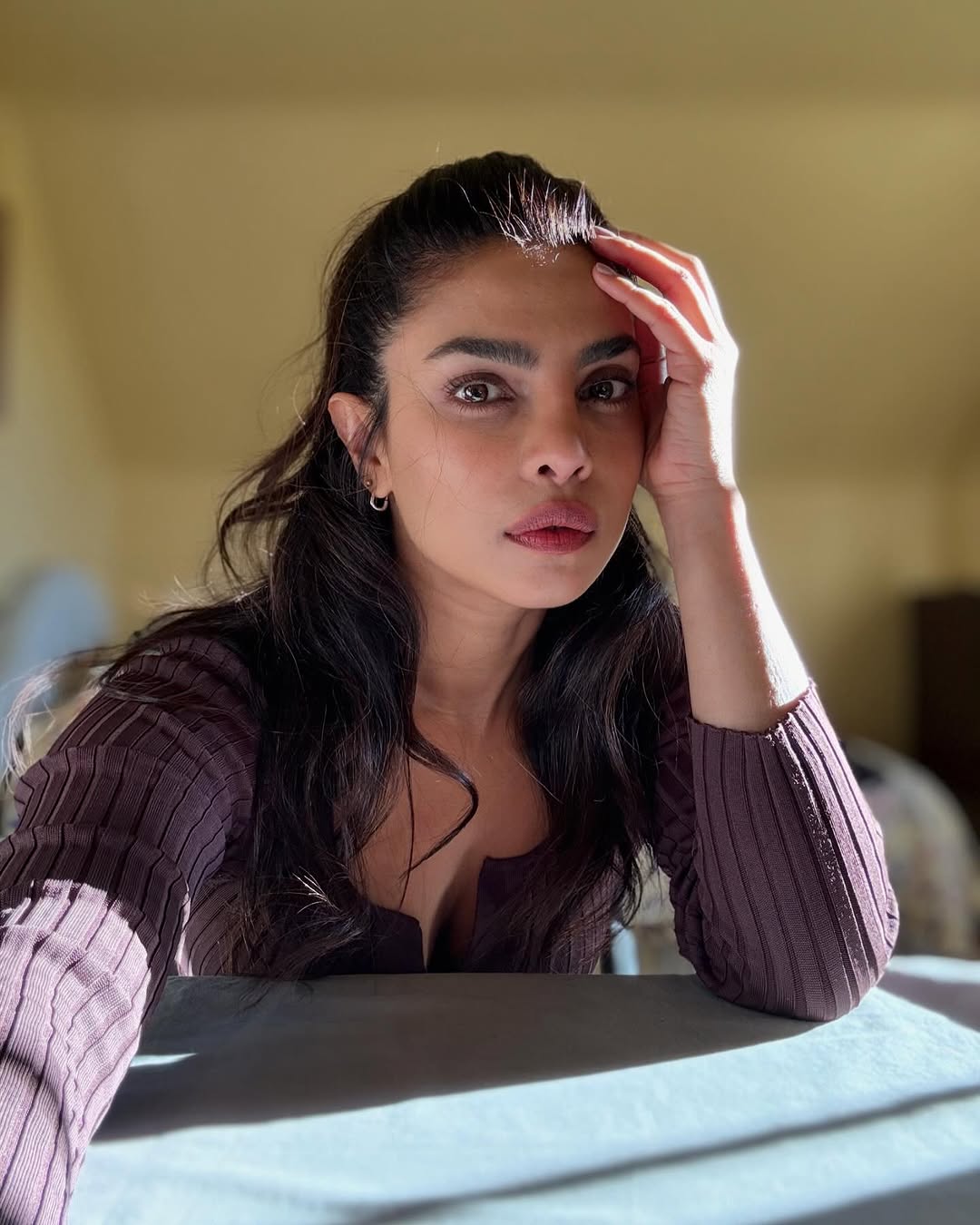 Priyanka's deep, dark eyes are both captivating and expressive.