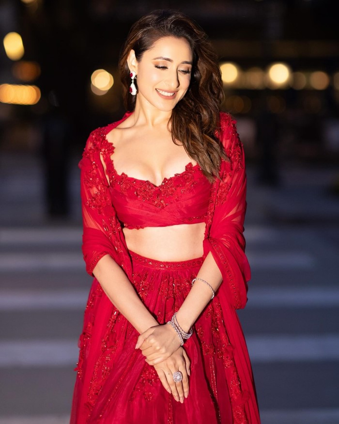 The red lehenga highlighted Pragya's ability to blend tradition with modern glamour, creating a captivating and memorable look.