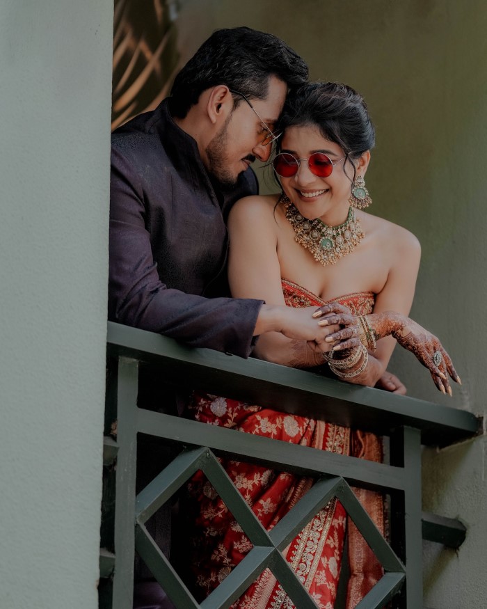 The couple radiates happiness and excitement, perfectly captured in candid moments during the photoshoot.