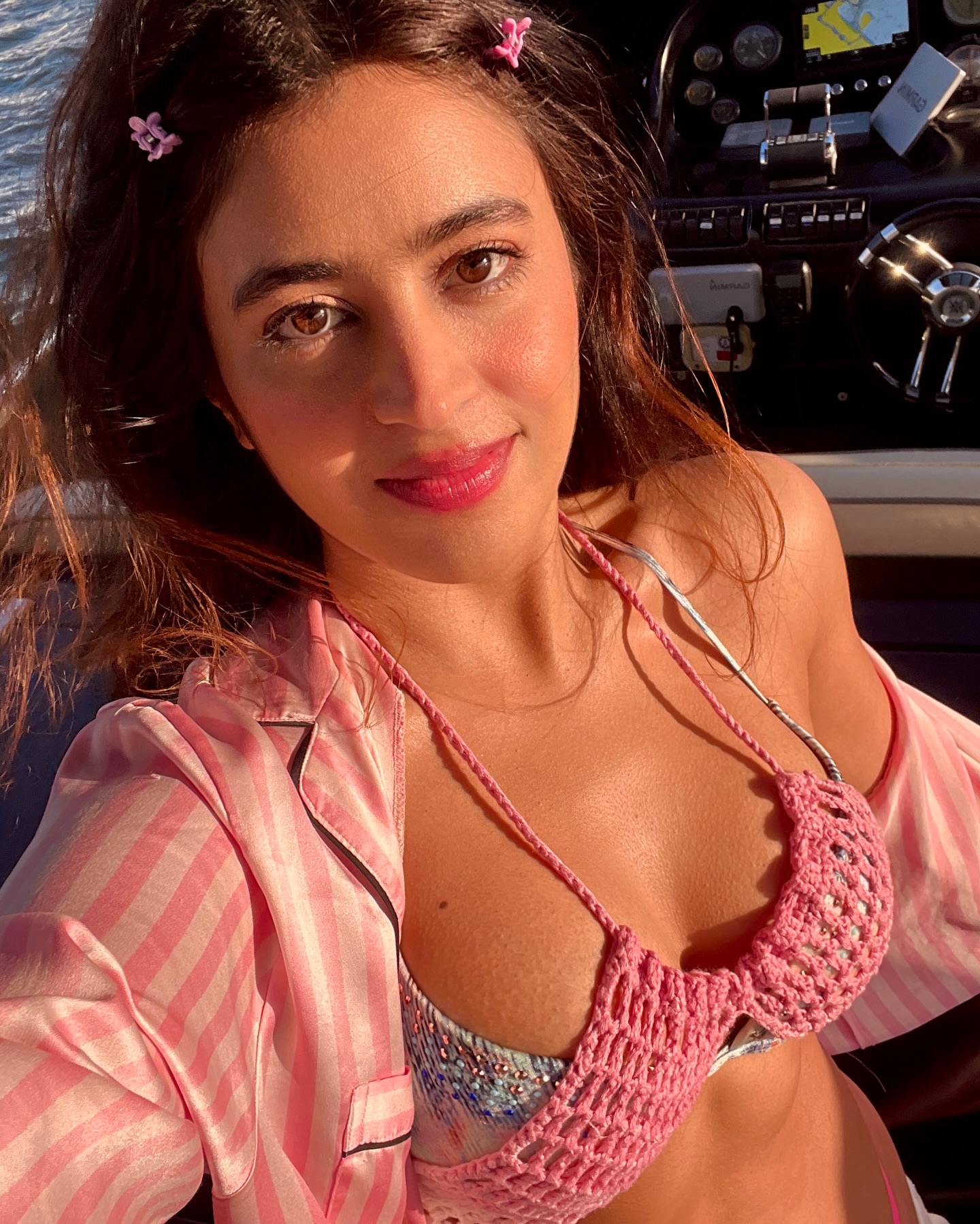 Shobhita Rana stuns in a chic pink and white crochet bikini top, paired with trendy white joggers, perfect for a breezy yacht day in Dubai.