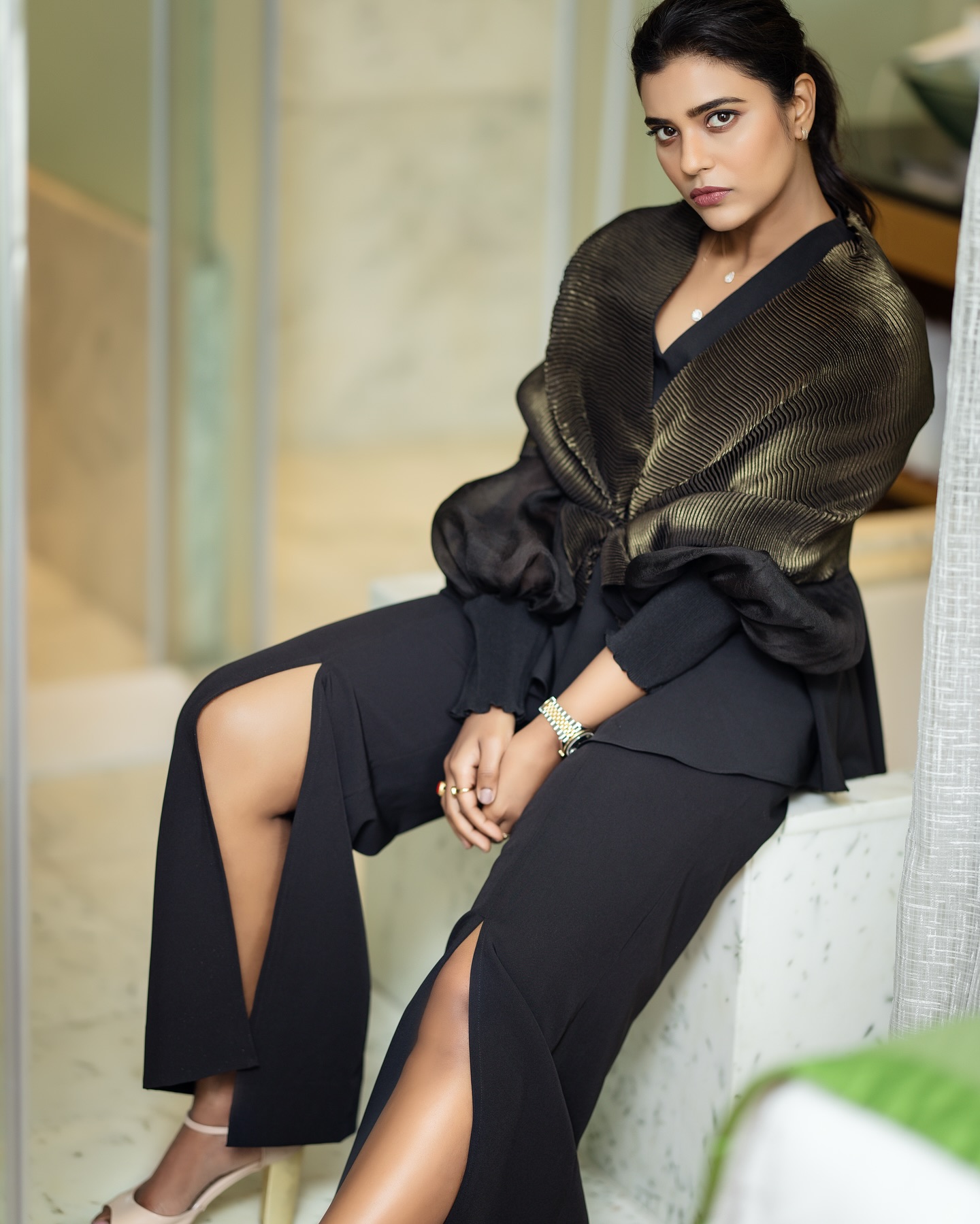 Aishwarya Rajesh stuns in an all-black outfit featuring a structured blazer and slit trousers.