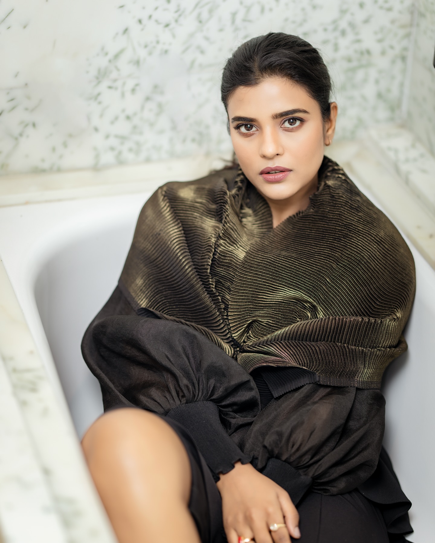 Aishwarya Rajesh stuns in an all-black outfit featuring a structured blazer and slit trousers.