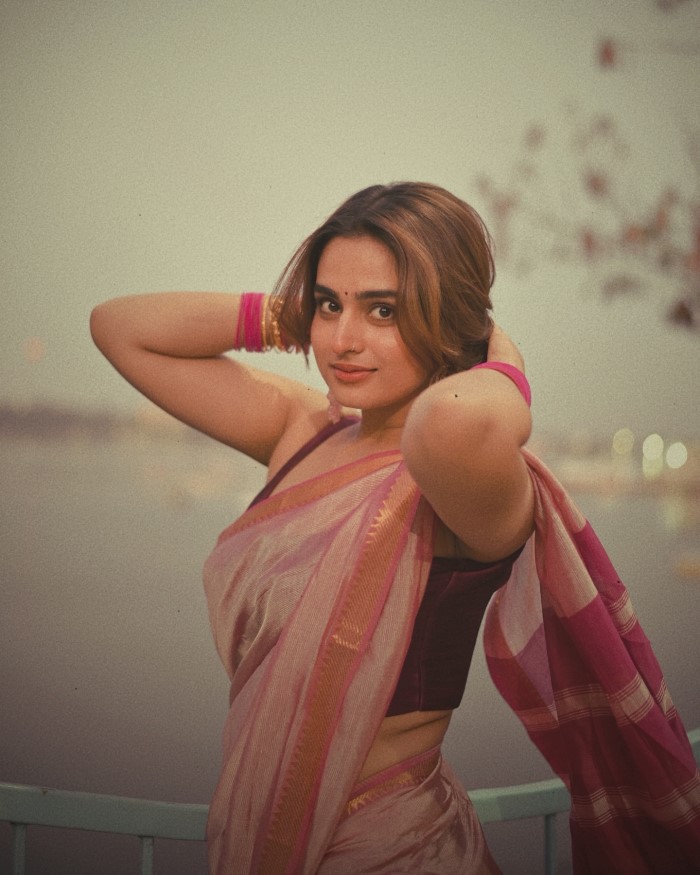 Ayesha Khan's Timeless Elegance: Graceful Pose By The Calm Water