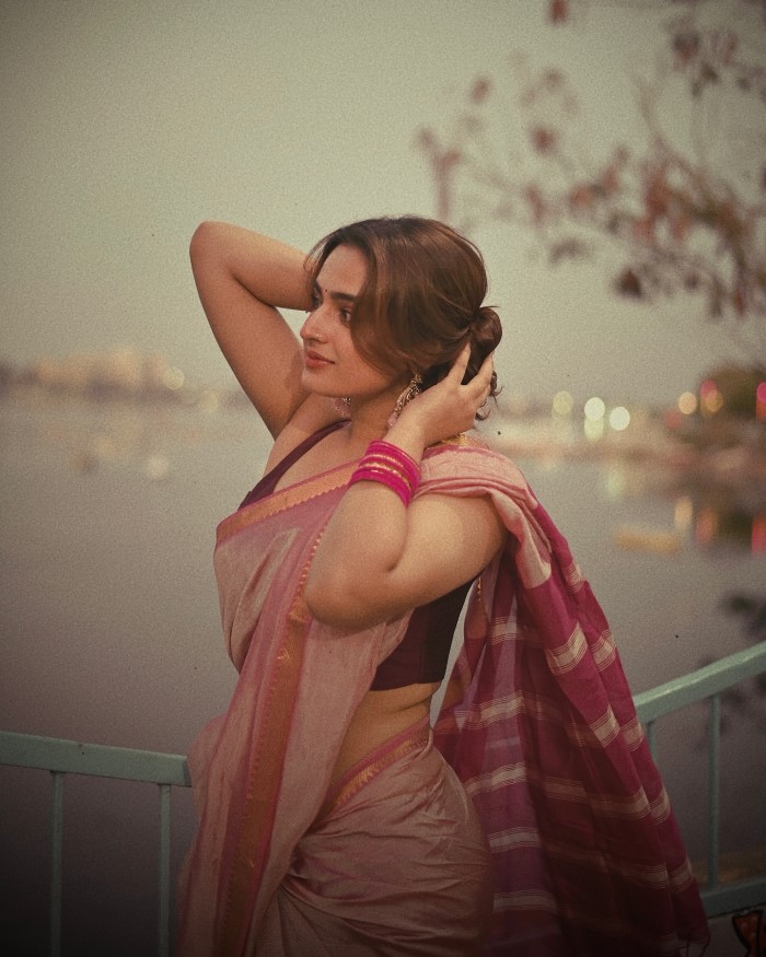 Ayesha Khan's Timeless Elegance: Graceful Pose By The Calm Water