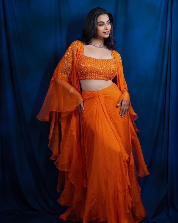 Meenakshi Chaudhary Stuns In Bold Orange Ensemble: A Modern Ethnic Fashion Statement