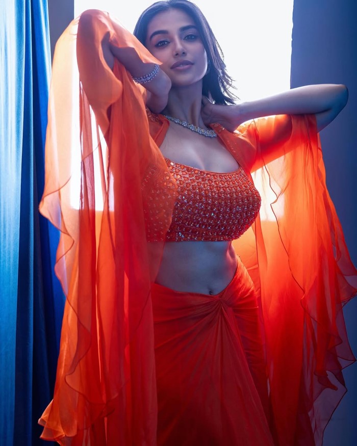 Meenakshi Chaudhary Stuns In Bold Orange Ensemble: A Modern Ethnic Fashion Statement
