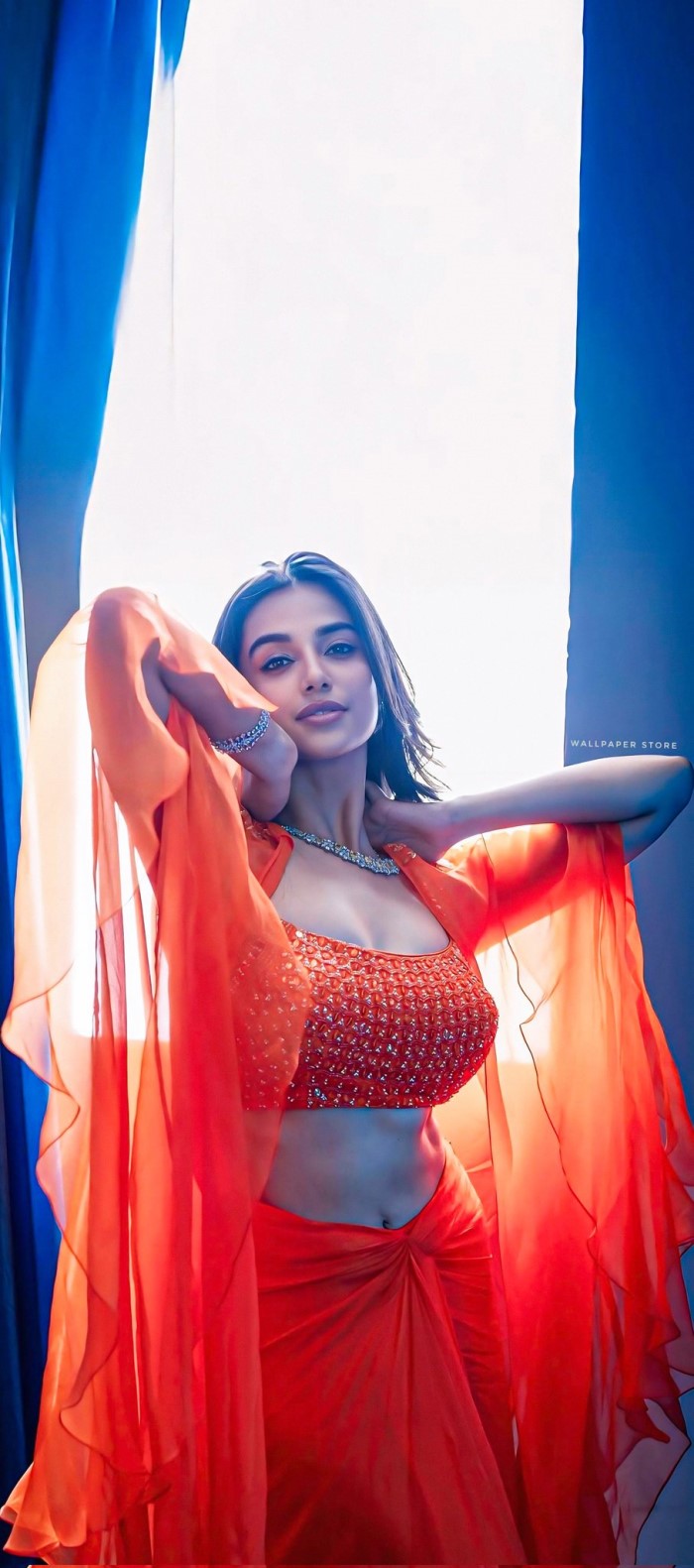 Meenakshi Chaudhary Stuns In Bold Orange Ensemble: A Modern Ethnic Fashion Statement