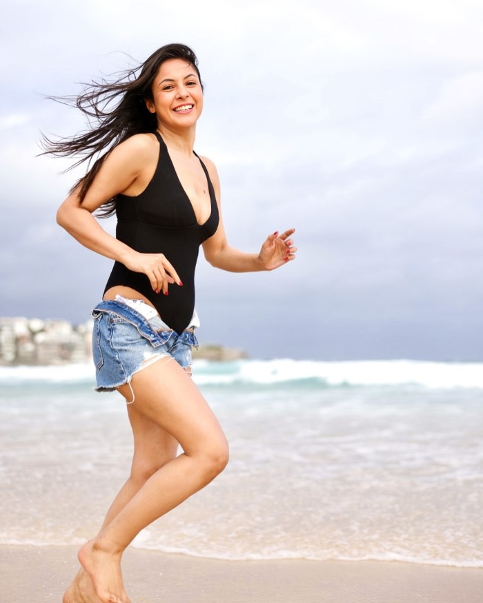 Shehnaaz Gill Stuns In Black Swimsuit And Denim Shorts At The Beach