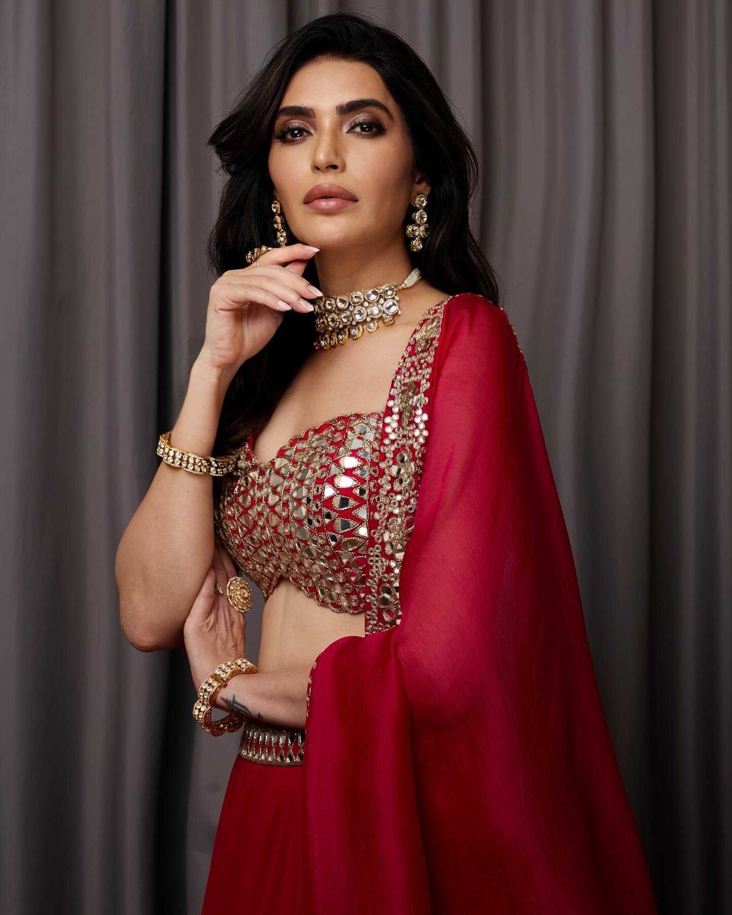 Bold, confident, and  stunning—Karishma Tanna wears the passion and energy of red.