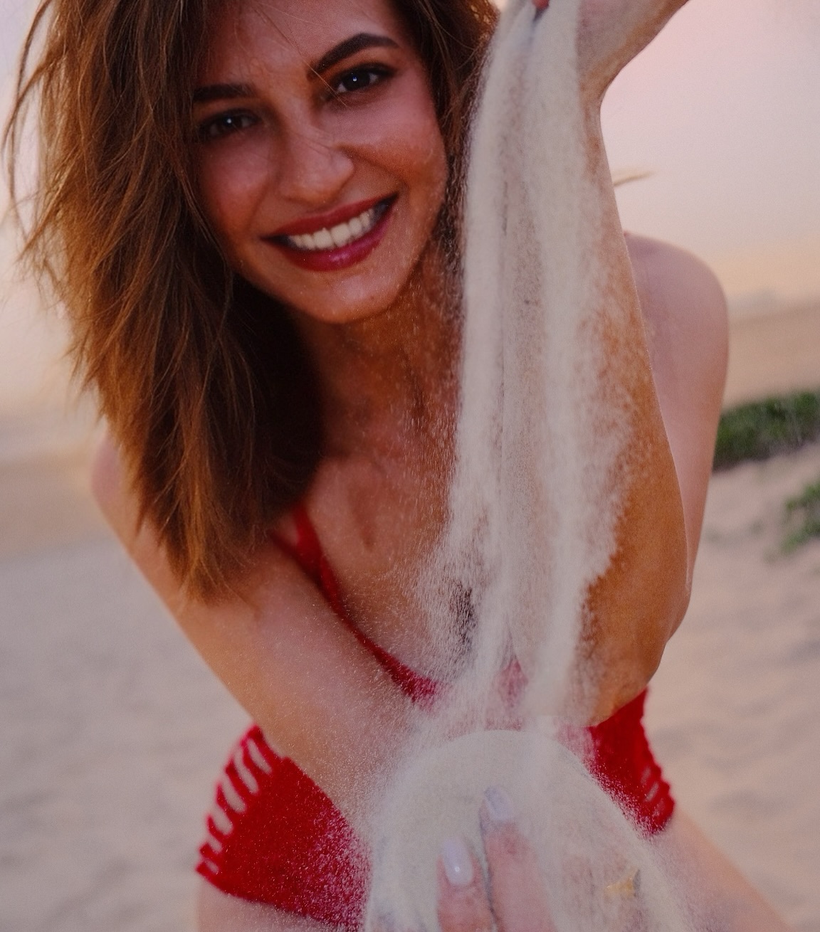 Kriti Kharbanda Shines In Red Swimsuit During Beach Vacation