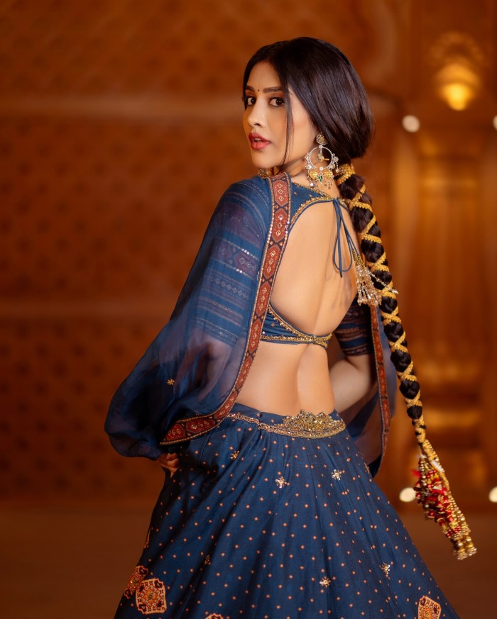 Nabha Natesh sported a beautifully braided ponytail complemented by a delicate bindi, enhancing her graceful appearance.