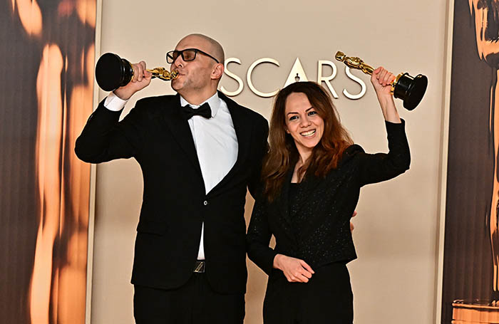 Iranian animator and film director Shirin Sohani and Iranian animator Hossein Molayemi pose in the press room with the Oscar for Best Animated Short Film for In the Shadow of the Cypress durin