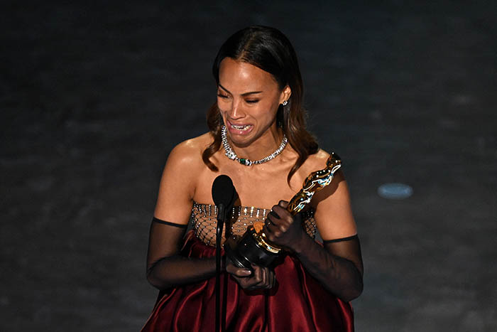 US actress Zoe Saldana accepts the award for Best Actress in a Supporting Role for Emilia Perez onstage during the 97th Annual Academy Awards at the Dolby Theatre in Hollywood, California on M