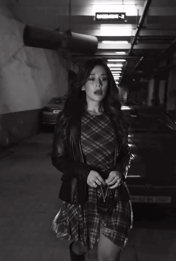 Krishna Shroff's Short tulle dress featuring a round neck, long sleeves, draped detail at the waist, asymmetric hem and a contrast lining serves as the perfect party dress when on a vacation.