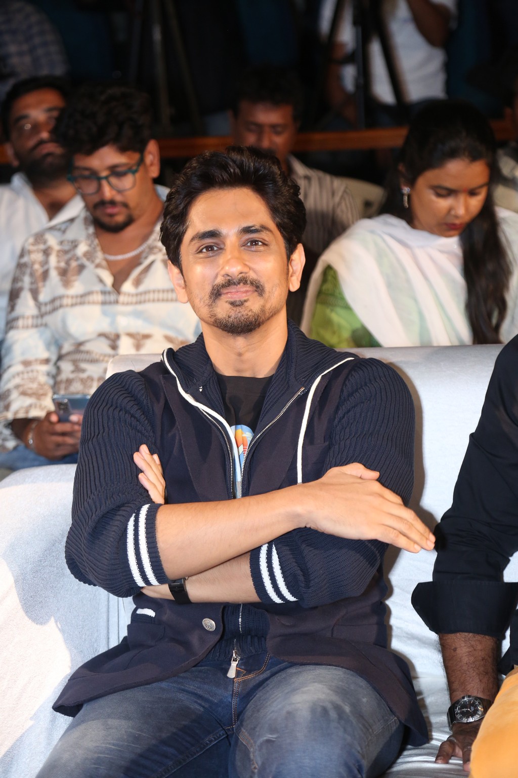 Siddharth was captured seated and smiling, radiating his trademark charm and ease