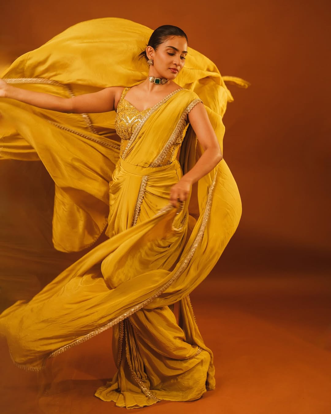 Twirling in yellow like it’s a dance-off with the sun–and spoiler alert: she’s winning in heels