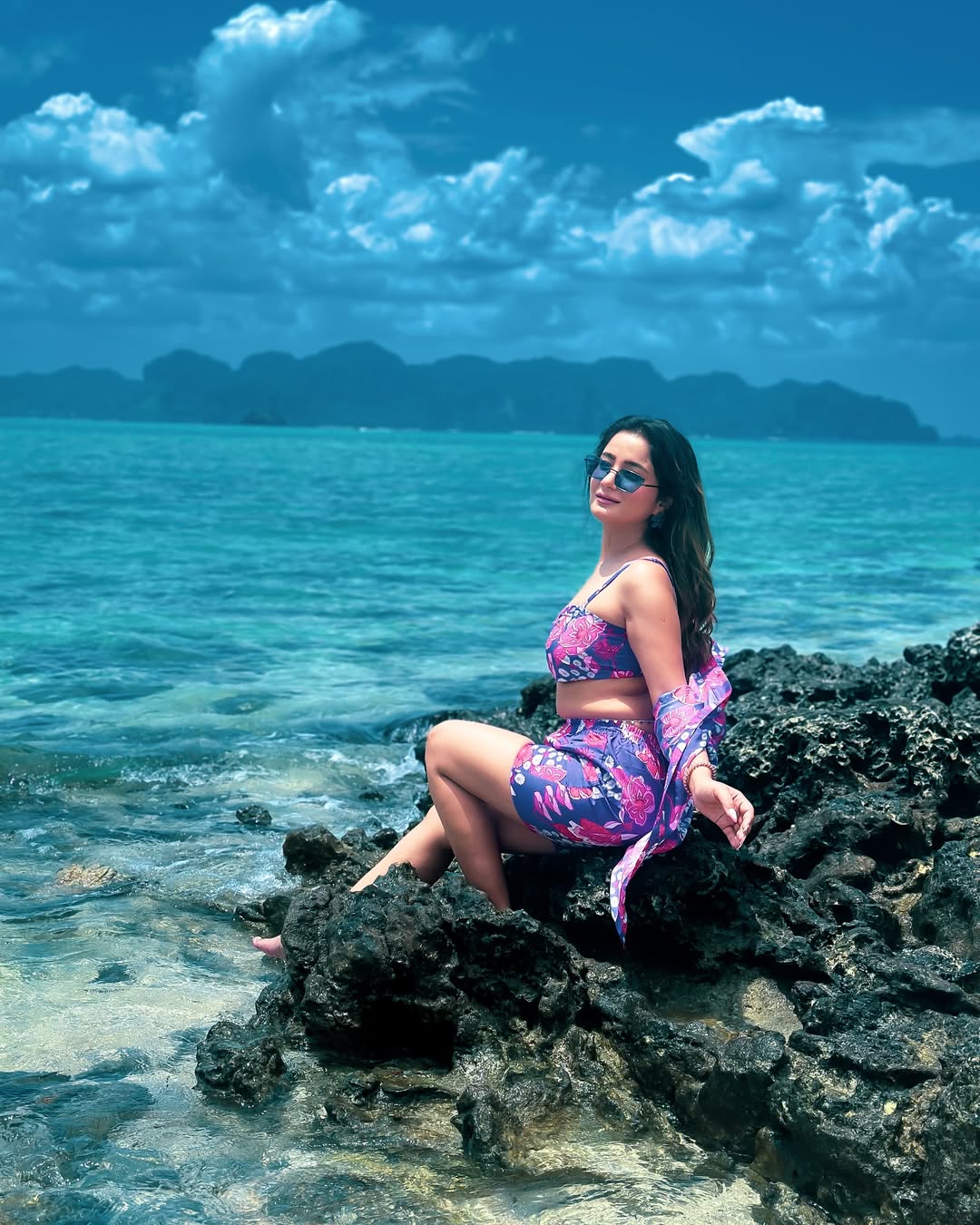 Floral dress? Check. Attitude? Loaded. Anila’s making seaside rocks look like front-row seats at Paris Fashion Week