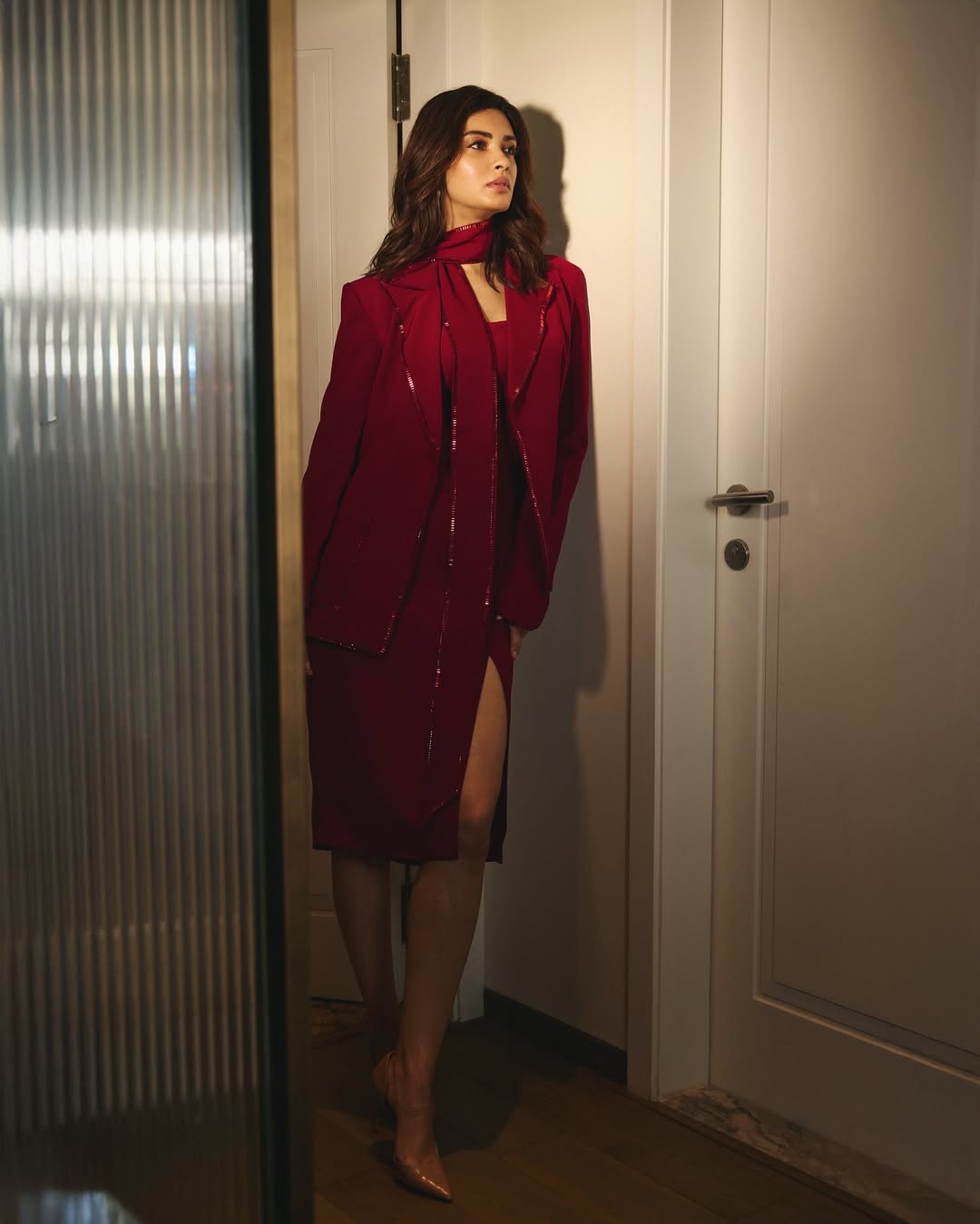 Diana Penty commands attention in a fiery red ensemble that effortlessly blends boardroom power with red carpet drama–because who says you can’t close deals and steal hearts at the same time