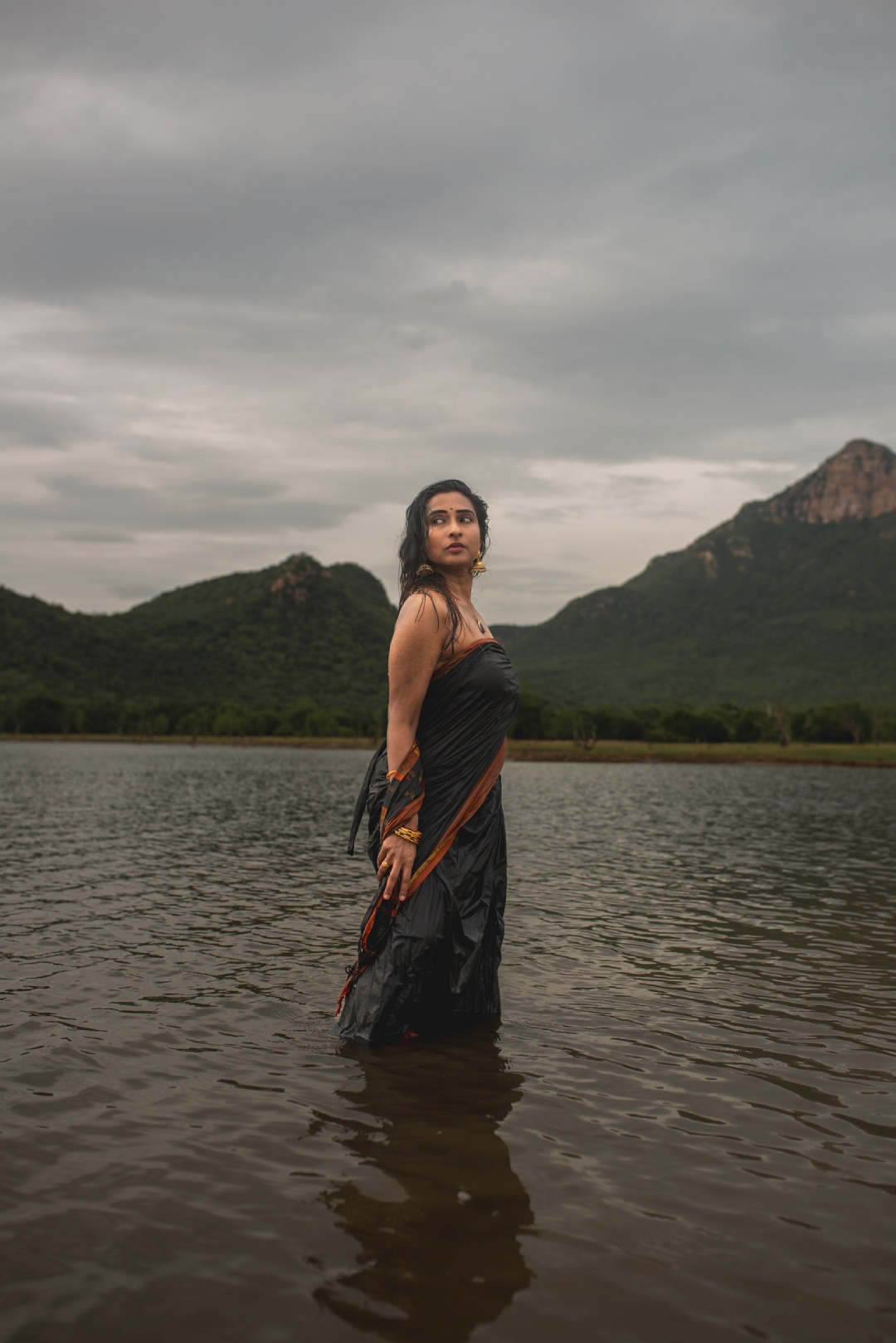 Dr. Ramya’s out here redefining water-resistant glam-splashing drama, elegance, and a saree that’s clearly got a PhD in fashion