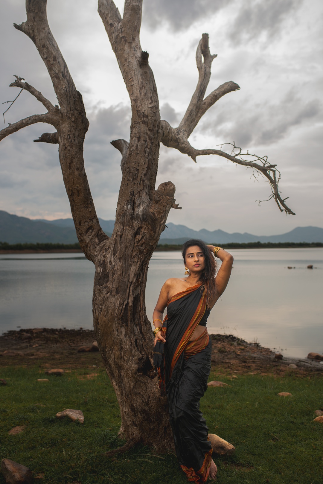 Who needs sunshine when Dr. Ramya is out here lighting up riversides with couture, confidence, and cloud-proof charisma