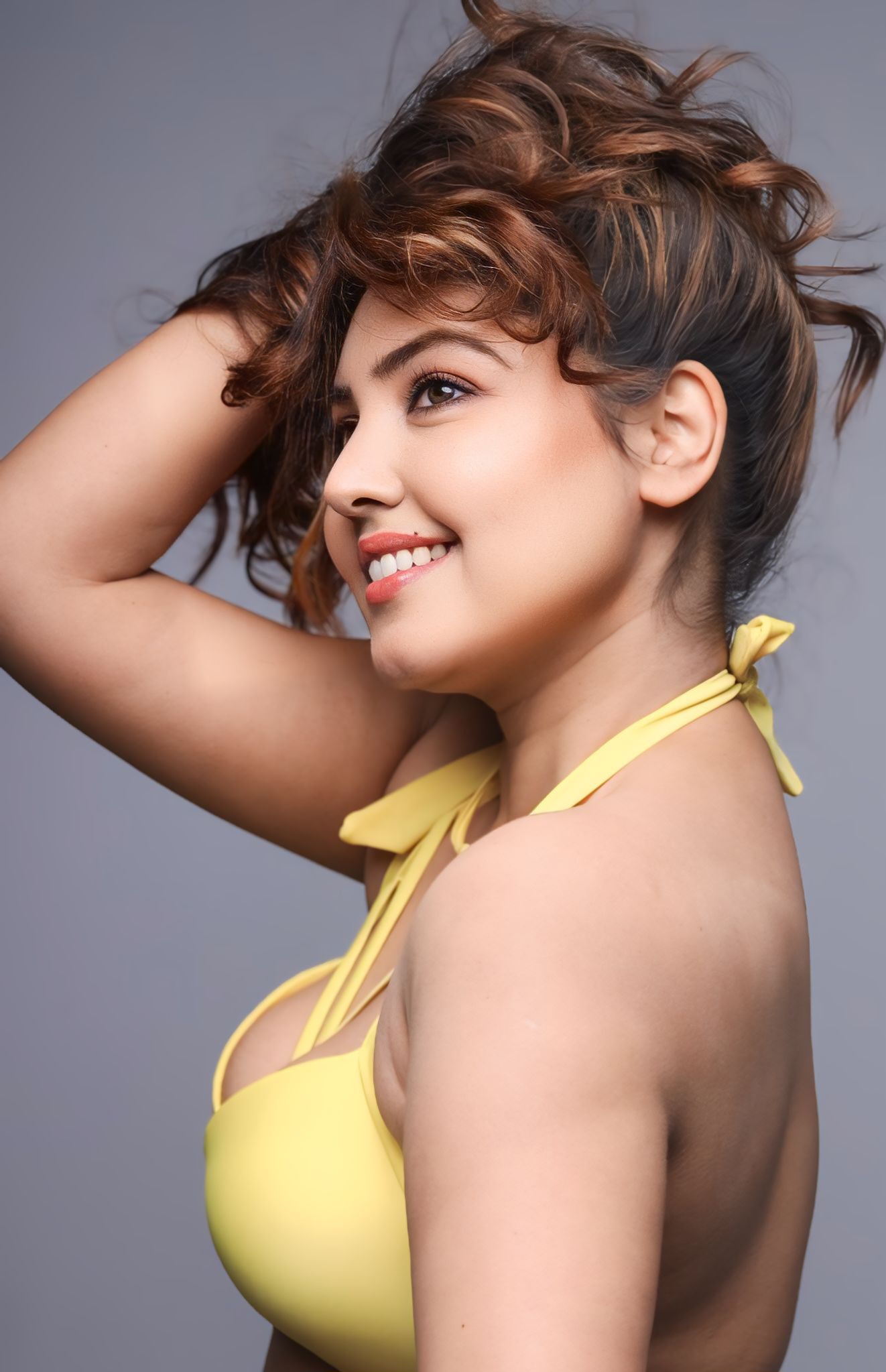 With her playful yellow bikini and carefree hair flip, Komal Jha is basically summer’s hottest splash–proof that a little sunshine and a big smile are the ultimate style accessories