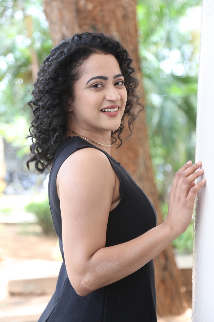 Shruti Shetty radiates quiet strength and warmth amidst the peaceful greenery