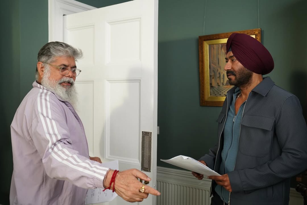 Director Vijay Kumar Arora is seen briefing Ajay Devgn on a scene, script in hand, as the duo discusses the film’s high-stakes moments