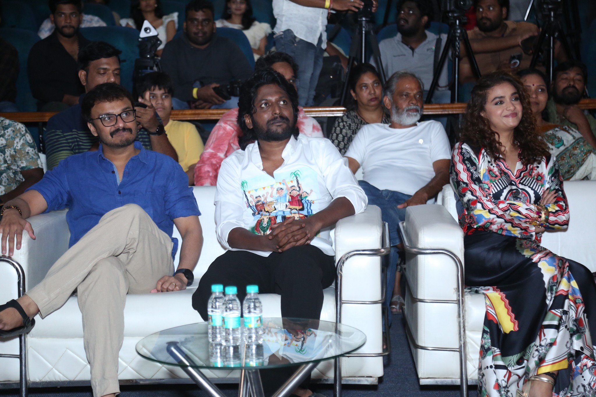 Keerthy Suresh, Suhas, and Ani I.V. Sasi were seen seated together, attentively following the event proceedings with interest