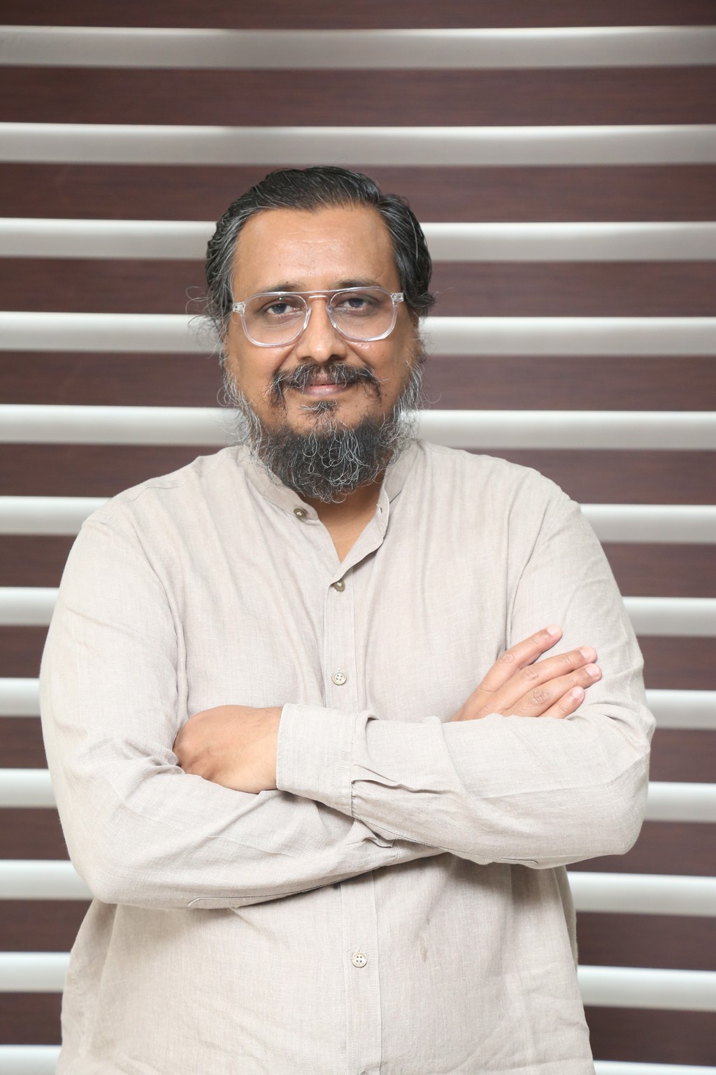 Venu Sriram keeping it cool in a relaxed beige shirt, looking like he’s about to drop life lessons – or at least convince you he’s the wittiest guy in the room