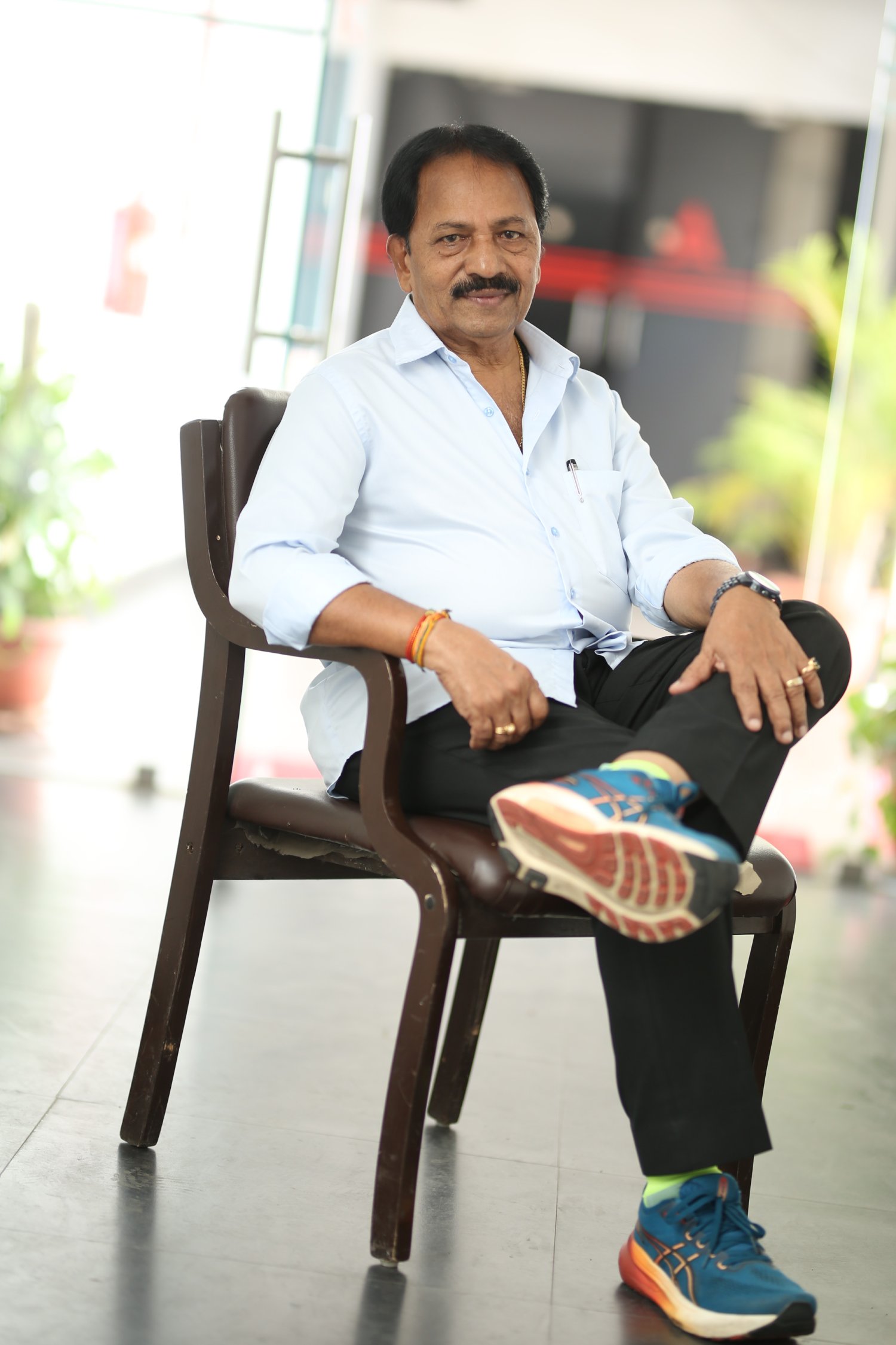 A. M. Rathnam proves that even in a crisp shirt and sneakers, he’s always running ahead of style–comfort, confidence, and a dash of humor in every step!