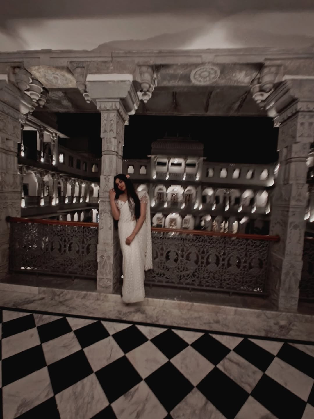 Adah Sharma in elegant white, effortlessly blending royal grace with a touch of playful charm–proof that classic style never needs an upgrade, just a good backdrop!