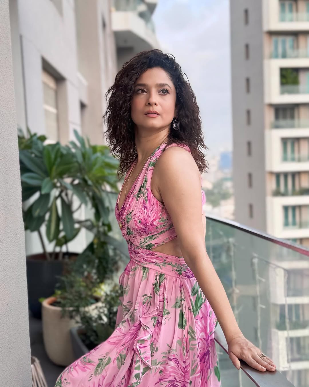 Ankita Lokhande in a stunning pink floral dress–proof that even on the balcony, she’s got the perfect blend of elegance, style, and just a hint of “balcony boss lady” attitude!