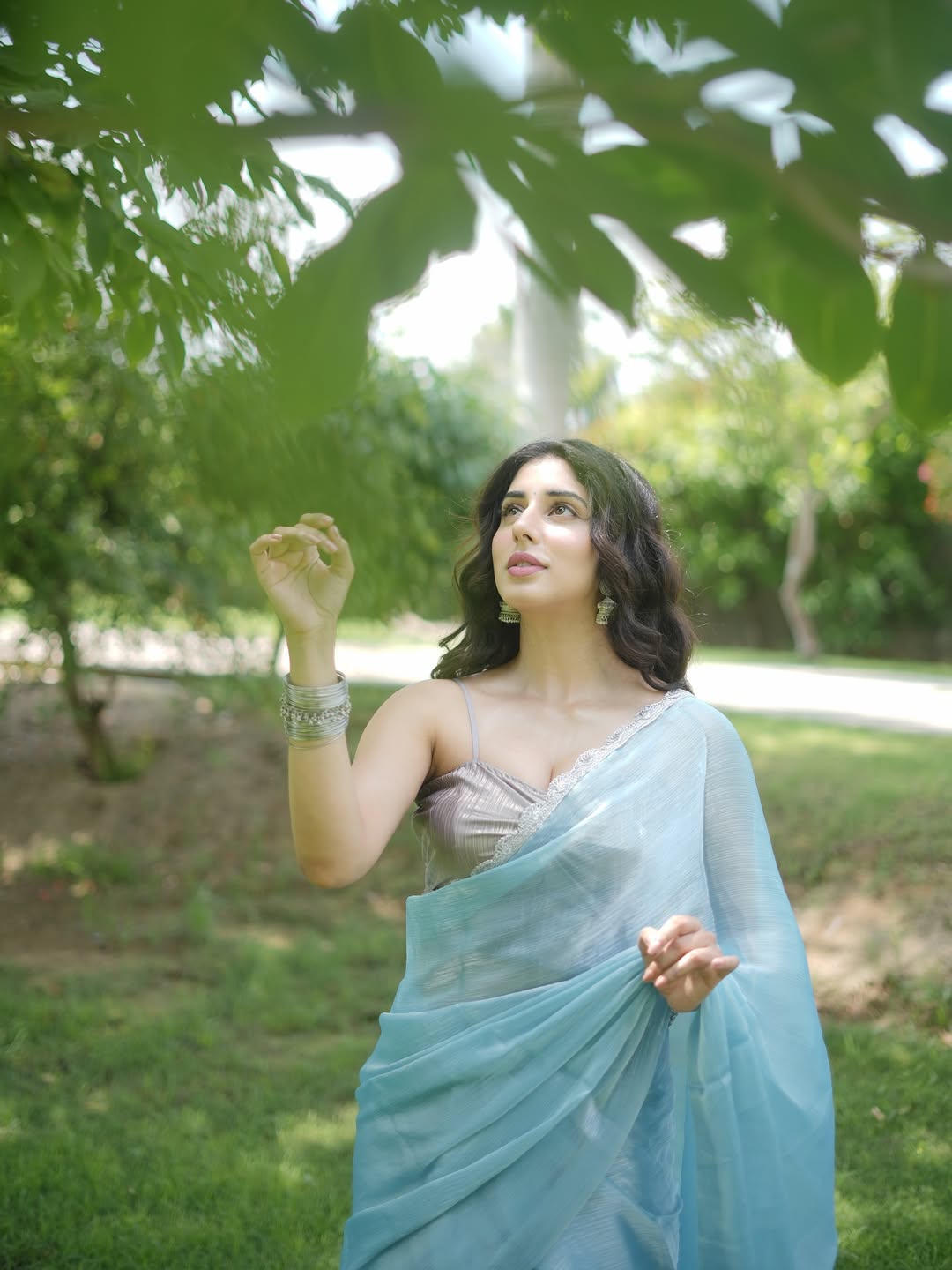 Jasmin Bajwa in a breezy blue saree proves that timeless elegance with a touch of playful charm can turn any garden into a runway–fashionably floating and effortlessly fabulous!
