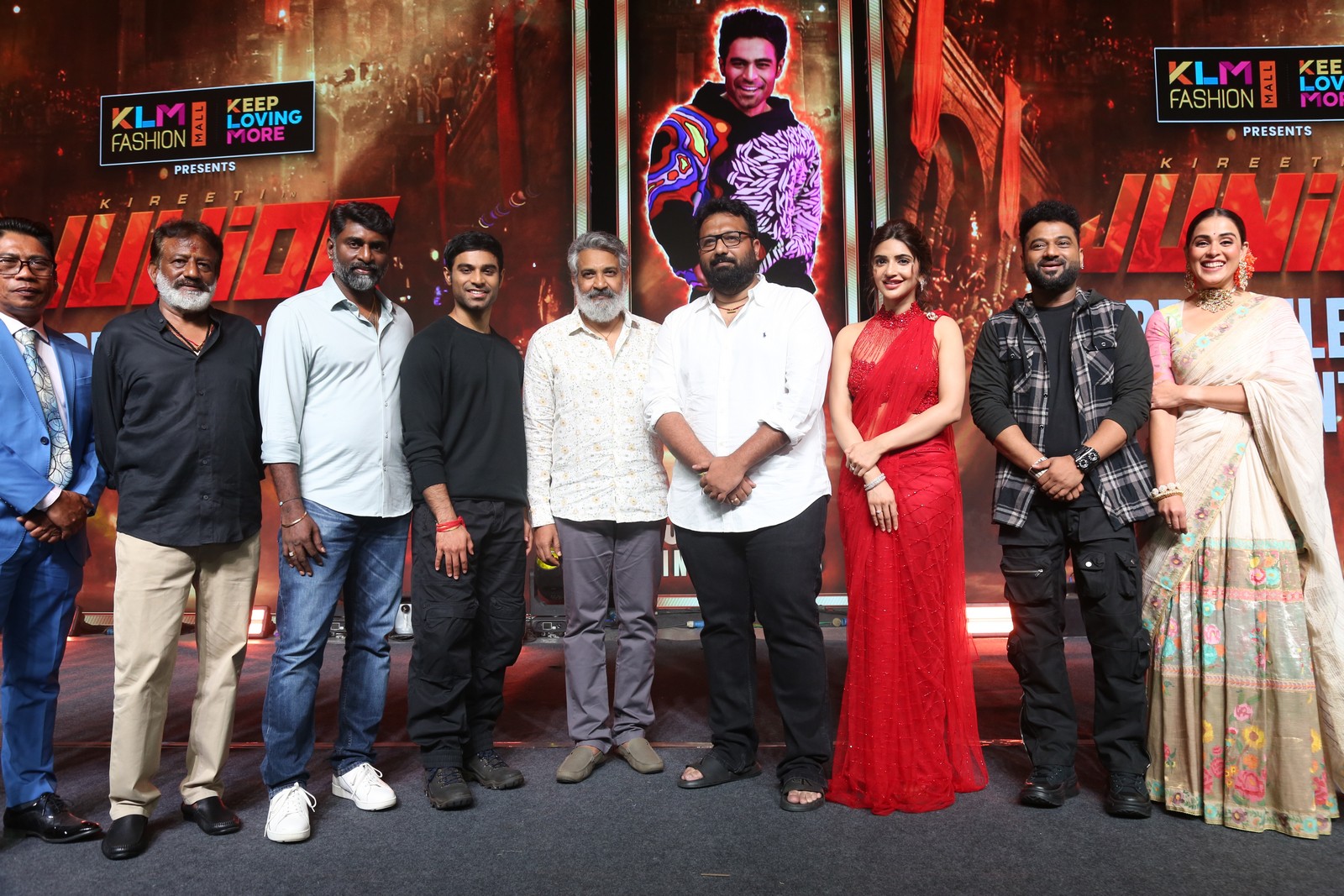 Cast and crew members come together for a group photo session at the grand pre-release event.