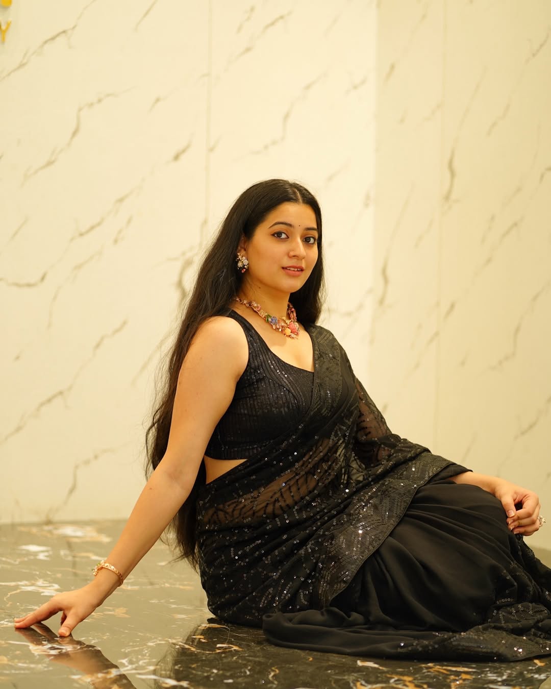 Kanduri Sudha dazzling in black–because who needs a tiara when a little glitter and loads of style turn life into a runway?