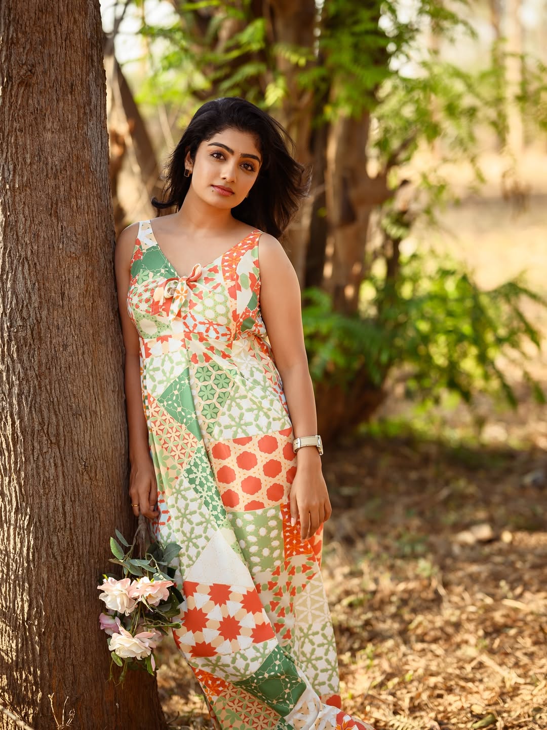Kavya Shaiva effortlessly blends boho chic with a splash of sunshine–her vibrant dress and confident stance prove that style is all about making a statement, even if it’s just to the trees!