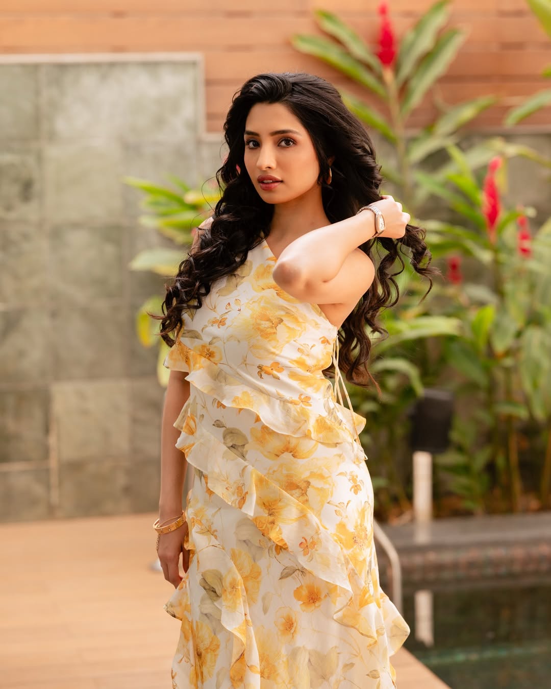 Manisha Kandkur proves that floral prints and flowing ruffles are the ultimate recipe for sunshine–turning a garden into her runway with effortless elegance and a dash of glam!