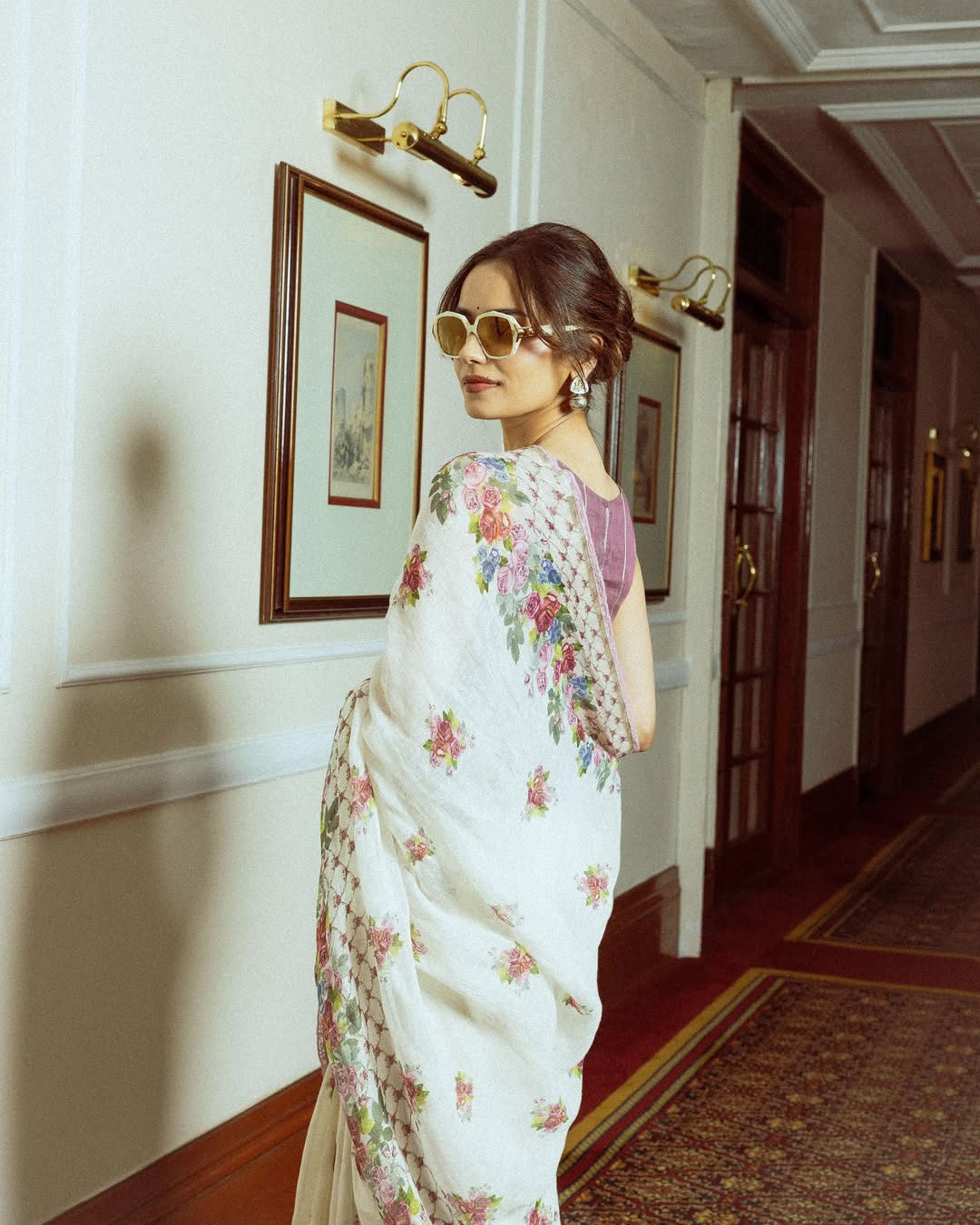 Manushi Chhillar exudes timeless elegance with a modern twist, proving that floral finesse and chic sunglasses are the perfect accessories for a style icon on the move!
